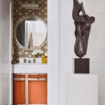Custom polished Nickle bathroom vanity's with orange resin detail