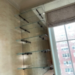 Custom blackened steel shelving supports - installed by RBL as well.