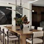 Custom bleached walnut NYC dining room table. With two medium antique brass metal inlays on each side