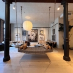 Custom antique brass ceiling hung swing in an NYC Soho loft - Upholstery RBL