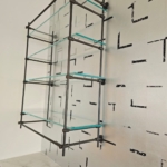 Custom bar hanging system. Dark antique brass. Satin lacquer coat. Glass and matched integrated hardware on the cabinets. Metal Work. RBL METALS - Wood Working for this project New Day Woodwork.