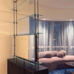 Custom NYC tv unit /divider. Tv on one side. Mirror on the other. Metal and glass By RBL We also did the integrated hardware on the cabinet . One stop shops. Woodwork for this project New Day Woodwork.