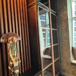 Custom copper and glass doors with unique integrated hardware style. Copper metal inlays and frames also all By Rbl Metals Design Credit Drew Mcgukin WoodWork for this project New Day Woodwork