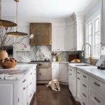 Custom antique brass hood. With channels on each side. Satin lacquer. All hand made. For a home in Westport Ct