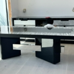 Blackened custom steel dining room table edge By RBL metals.
