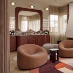 Custom mahogany bar with stone and mirror. Polished brass By Rbl Metals 2