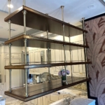 Custom antique brass with rivets and walnut bistro shelves - Ceiling hung By Rbl too. Hand made. Here in Ny & Pa
