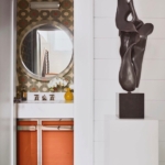 Custom polished nickel frame. Hardware for this orange bathroom all hand made. Metal work By Rbl Metals